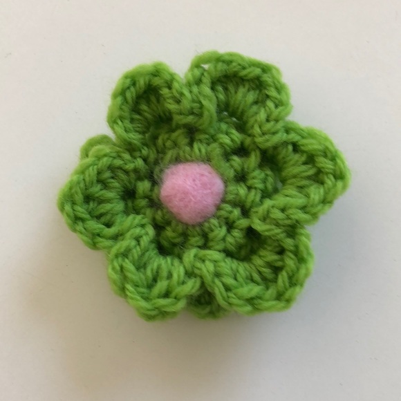 Crochet flower pin adds a bit of fun to your winter wardrobe - Picture 1 of 3